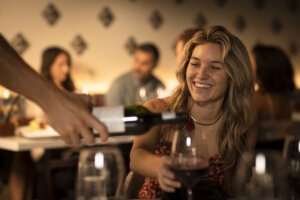 Server Pouring a Wine Spectator Award Red Wine